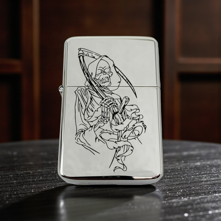 HipFlaskPlus chrome windproof lighter featuring a detailed grim reaper dealer of death engraving on the front