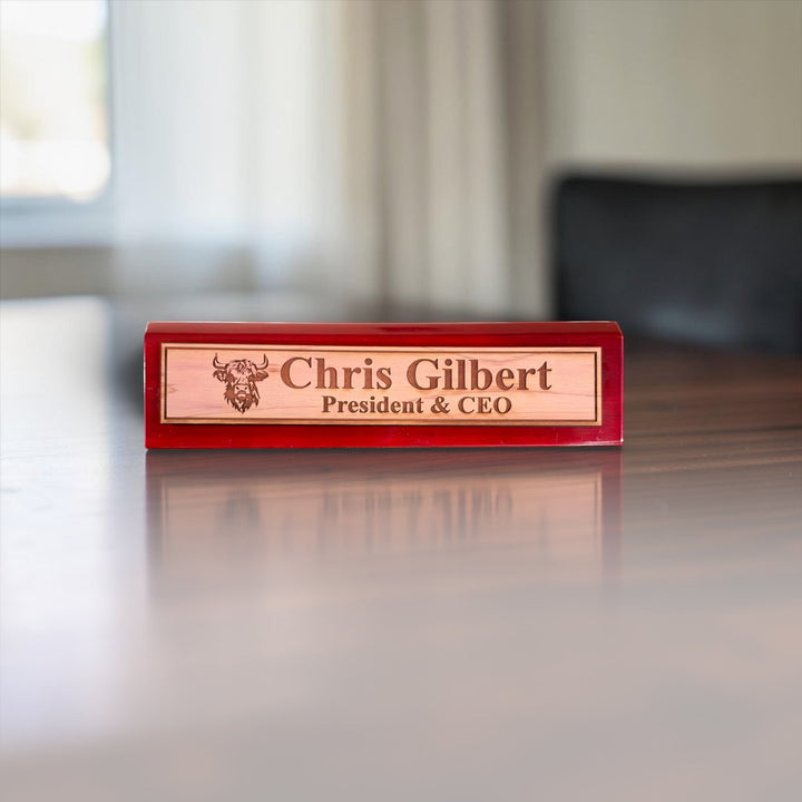 HipFlaskPlus personalized 11-inch desk wedge name plate with Highland Cow engraving and rosewood piano finish.