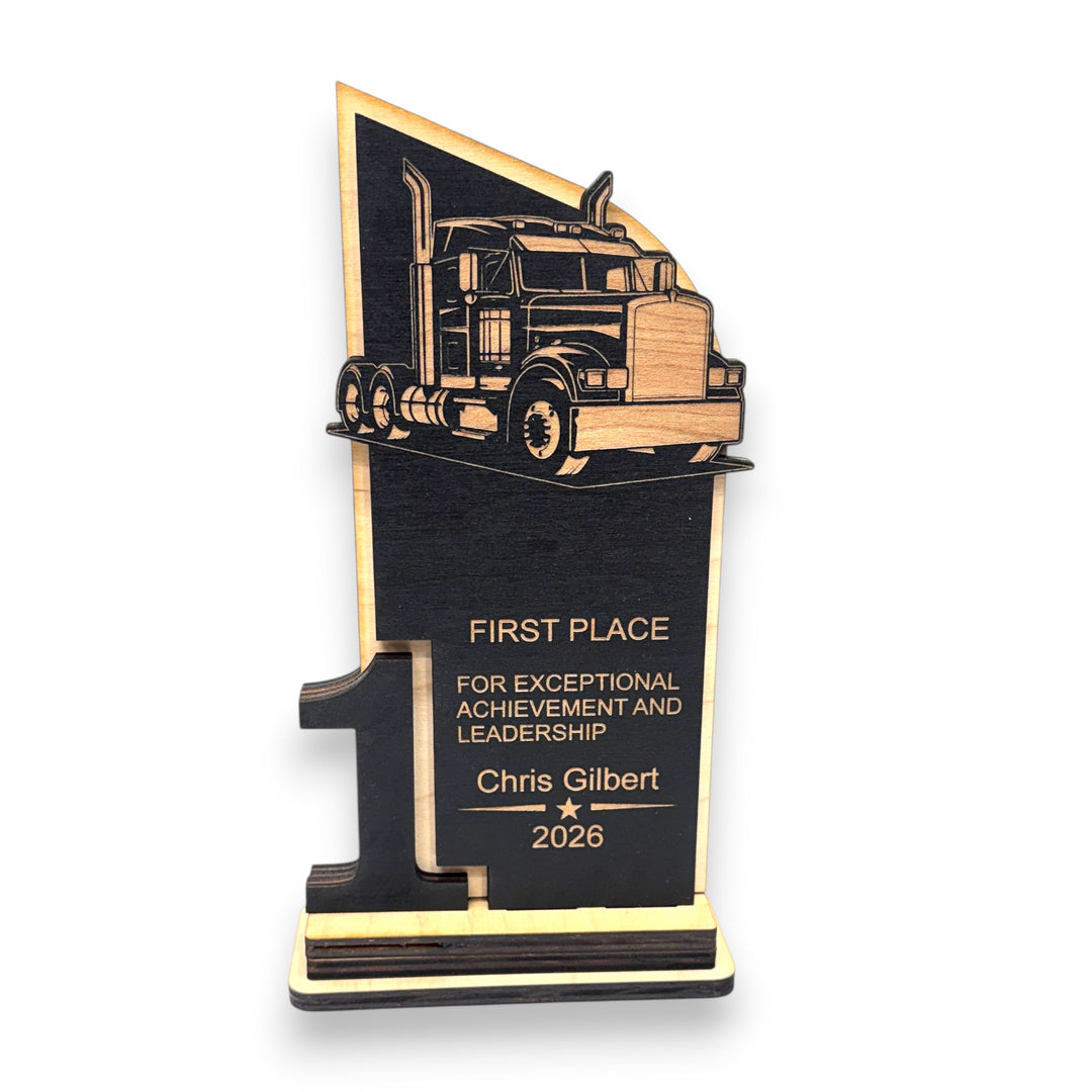 HipFlaskPlus personalized maple wood trophy featuring a laser-engraved big rig diesel truck for first place awards.