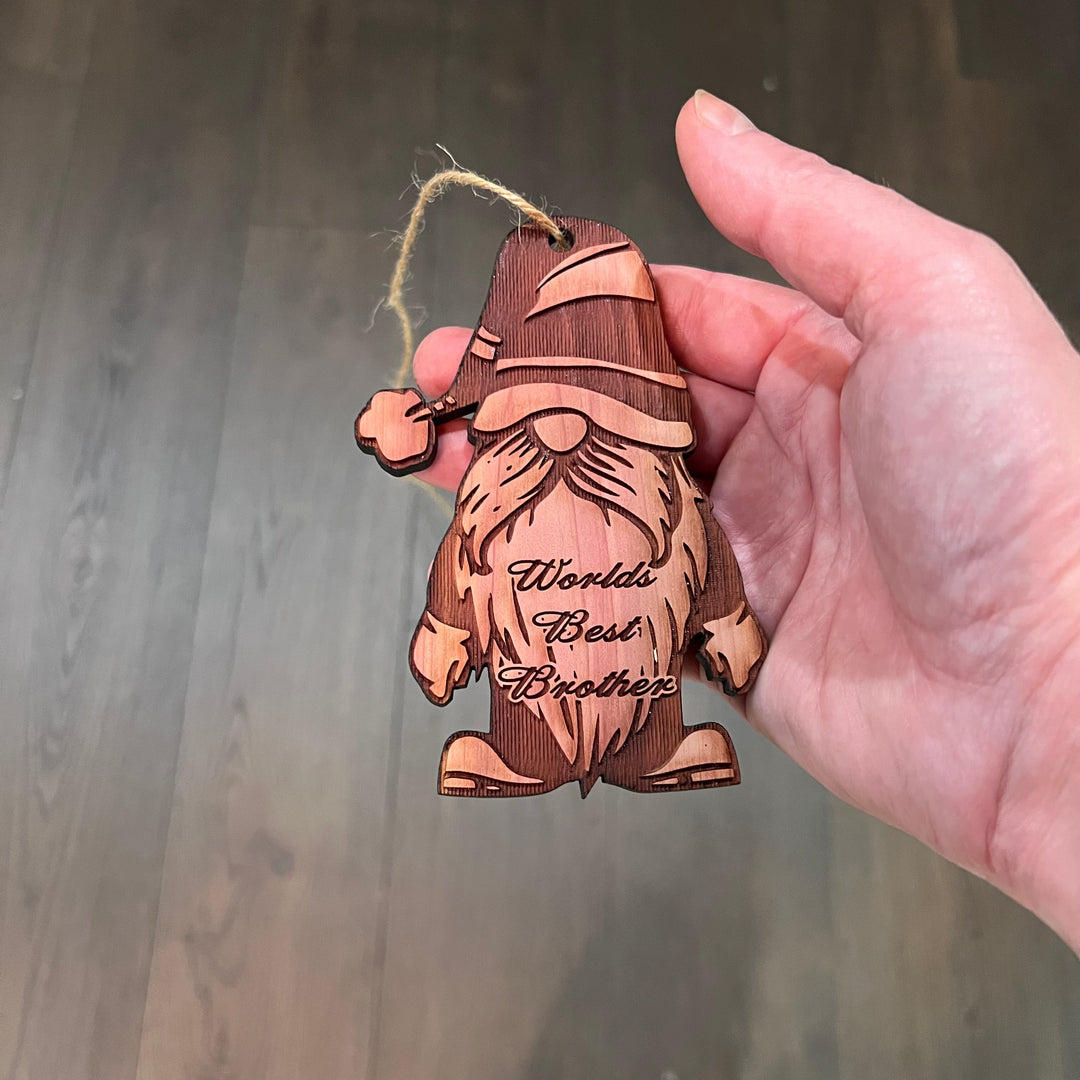 Hand holding a HipFlaskPlus cedar wood World&