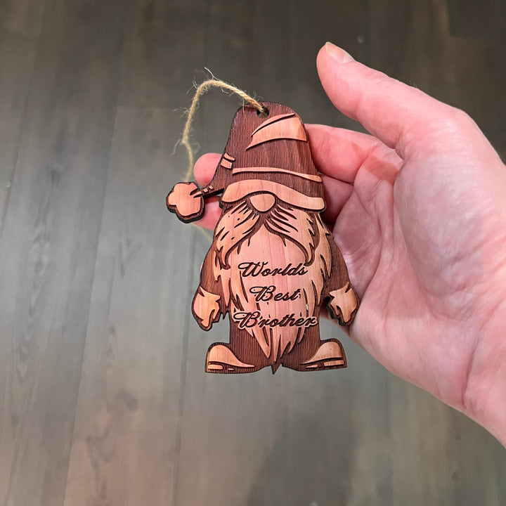 Hand holding a HipFlaskPlus cedar wood World&