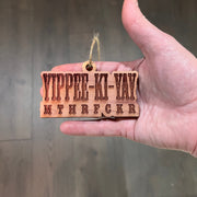 Yippee-ki-yay - Cedar Ornament